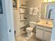 Bathroom featuring a toilet, sink, and storage shelving at 2801 S Ocean Blvd. # 1535, North Myrtle Beach, SC 29582