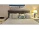 Cozy bedroom with beach theme decor, bedside tables and lamps at 2801 S Ocean Blvd. # 1535, North Myrtle Beach, SC 29582
