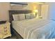 Comfortable bedroom features soft lighting, decorative pillows, and coastal artwork at 2801 S Ocean Blvd. # 1535, North Myrtle Beach, SC 29582