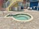 Outdoor hot tub with brick patio and blue building in the background at 2801 S Ocean Blvd. # 1535, North Myrtle Beach, SC 29582