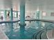 Bright indoor pool with turquoise support columns and stainless steel ladder at 2801 S Ocean Blvd. # 1535, North Myrtle Beach, SC 29582