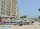 Outdoor swimming pool with sunbathers at condo community with beach access at 2801 S Ocean Blvd. # 1535, North Myrtle Beach, SC 29582