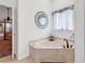 Elegant bathroom with a luxurious corner soaking tub and decorative window treatment at 2818 Sanctuary Blvd., Conway, SC 29526