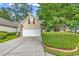 Charming home with a well-manicured lawn, mature trees, and a two-car garage at 2818 Sanctuary Blvd., Conway, SC 29526
