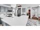 Bright kitchen features gray cabinets, stainless steel appliances, and a white countertop island, creating a stylish space at 2818 Sanctuary Blvd., Conway, SC 29526