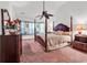 Spacious main bedroom featuring a four-poster bed, bay window, and elegant decor, creating a luxurious retreat at 2818 Sanctuary Blvd., Conway, SC 29526