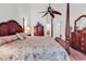 Elegant main bedroom with a four-poster bed, stylish decor, and ample space, creating a serene and inviting atmosphere at 2818 Sanctuary Blvd., Conway, SC 29526