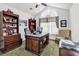 Bright office space featuring a large desk, shelving, and comfortable seating area at 2818 Sanctuary Blvd., Conway, SC 29526