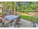 Back patio with a table, seating, and built-in BBQ perfect for outdoor entertaining and relaxation at 2818 Sanctuary Blvd., Conway, SC 29526