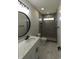 Bathroom features a marble vanity, large mirror, and tile shower with glass door at 287 West Palms Dr., Myrtle Beach, SC 29579