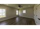 Bedroom with ceiling fan, hardwood floors, and natural light from a set of windows at 287 West Palms Dr., Myrtle Beach, SC 29579