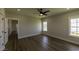 Bright bedroom featuring wood-look floors, neutral paint, and modern ceiling fan at 287 West Palms Dr., Myrtle Beach, SC 29579