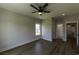 Bright bedroom with ceiling fan, hardwood floors, and ensuite bathroom access at 287 West Palms Dr., Myrtle Beach, SC 29579