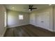 Spacious bedroom with natural light, ceiling fan, and plank flooring at 287 West Palms Dr., Myrtle Beach, SC 29579