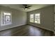 Bedroom with wood-look floors and large windows that bring in natural light at 287 West Palms Dr., Myrtle Beach, SC 29579