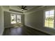 Bedroom with tray ceiling and large windows at 287 West Palms Dr., Myrtle Beach, SC 29579