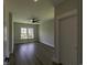 Bedroom with ceiling fan, wood-look floors and large windows that bring in natural light at 287 West Palms Dr., Myrtle Beach, SC 29579