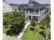 Two-story home with charming curb appeal, landscaped lawn, and inviting walkway at 287 West Palms Dr., Myrtle Beach, SC 29579