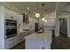 Modern kitchen features stainless steel appliances, white cabinets, and large island at 287 West Palms Dr., Myrtle Beach, SC 29579