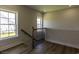 Upstairs landing with wood floors, neutral paint, and wrought iron staircase detail at 287 West Palms Dr., Myrtle Beach, SC 29579