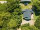 High angle view of the roof of the home with backyard deck, surrounded by trees at 309 Otter Run Rd., Pawleys Island, SC 29585