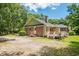 Back exterior view with deck, yard and brick detailing at 309 Otter Run Rd., Pawleys Island, SC 29585