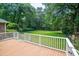 Spacious backyard view from wooden deck with white railing at 309 Otter Run Rd., Pawleys Island, SC 29585