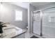 Modern bathroom featuring dual sinks, granite countertops, and a glass-enclosed shower at 309 Otter Run Rd., Pawleys Island, SC 29585