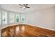 Spacious bedroom features tray ceiling, hardwood floors, and three large windows at 309 Otter Run Rd., Pawleys Island, SC 29585