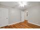 Empty bedroom with hardwood floors and ample closet space, offering a blank canvas for personalization at 309 Otter Run Rd., Pawleys Island, SC 29585