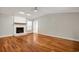 Living room with white fireplace, hardwood floors, neutral paint and ceiling fan at 309 Otter Run Rd., Pawleys Island, SC 29585