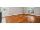 Living room featuring hardwood flooring and natural light from a bright window at 309 Otter Run Rd., Pawleys Island, SC 29585