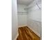 Walk-in closet with hardwood flooring and metal shelving, maximizes storage space at 309 Otter Run Rd., Pawleys Island, SC 29585