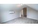 Sloped ceiling bedroom with neutral carpet, ample natural light, and climate control unit installed at 311 Six Mile Creek Dr., Georgetown, SC 29440