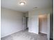Inviting bedroom boasts neutral carpet and a closet with bifold doors, creating a functional space at 311 Six Mile Creek Dr., Georgetown, SC 29440