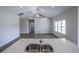 Close-up view of the kitchen island with a stainless sink and white quartz countertop at 311 Six Mile Creek Dr., Georgetown, SC 29440