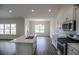 Open kitchen with stainless steel appliances and an island that overlooks the dining area at 311 Six Mile Creek Dr., Georgetown, SC 29440