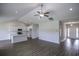 Spacious living room showcasing wood floors, vaulted ceilings, and an open floor plan to kitchen at 311 Six Mile Creek Dr., Georgetown, SC 29440