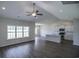 Open-concept living area featuring wood-look flooring, vaulted ceilings, and a view to the kitchen at 311 Six Mile Creek Dr., Georgetown, SC 29440