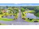 Scenic aerial shot showcasing the community entrance, water features, lush landscaping, and various community amenities at 312 Caldera Ct., Murrells Inlet, SC 29576