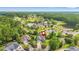 Beautiful aerial view of the neighborhood, showcasing lush greenery, community pool, and pond at 312 Caldera Ct., Murrells Inlet, SC 29576