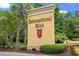 Elegant entrance sign for the International Club community, framed by lush landscaping and mature trees at 312 Caldera Ct., Murrells Inlet, SC 29576