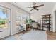 Bright home office featuring a large window, stylish furniture, and ample workspace at 312 Caldera Ct., Murrells Inlet, SC 29576