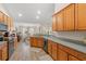 Spacious kitchen with wooden cabinets, granite countertops, stainless steel appliances, and an open floor plan at 312 Caldera Ct., Murrells Inlet, SC 29576