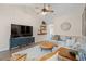 Spacious living room with vaulted ceilings, stylish furniture, and a modern entertainment center at 312 Caldera Ct., Murrells Inlet, SC 29576