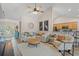 Open-concept living area showcasing comfortable seating, stylish decor, and a seamless transition to the kitchen at 312 Caldera Ct., Murrells Inlet, SC 29576