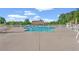 Community pool with ample lounge chairs, umbrellas, and well-maintained surrounding concrete at 312 Caldera Ct., Murrells Inlet, SC 29576