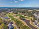 Aerial view of a golf course community with lush greenery and scenic landscaping at 318 Board Landing Circle, Conway, SC 29526