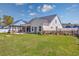 Spacious backyard featuring a patio, pergola, fenced yard, and well-maintained lawn at 318 Board Landing Circle, Conway, SC 29526