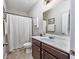 Bathroom with a vanity, toilet, shower-tub combo and tiled floors offering a clean space at 318 Board Landing Circle, Conway, SC 29526
